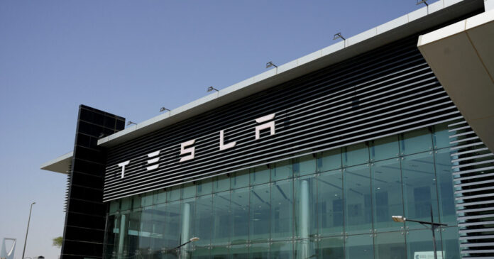 tesla cars showroom reuters 1200x630.jpg