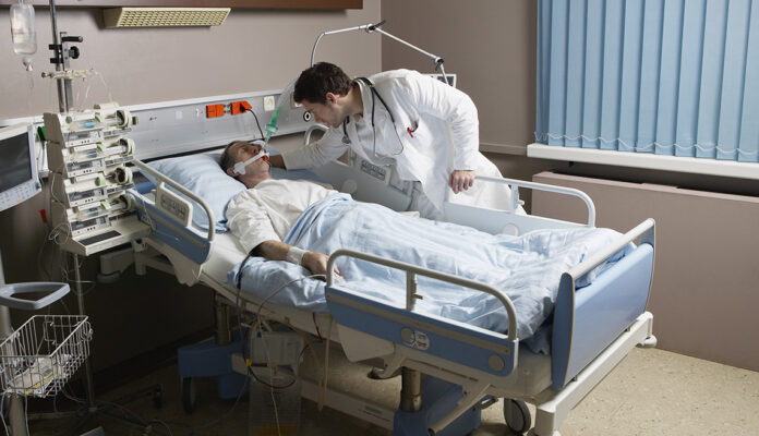 1140 patient in hospital bed.jpg