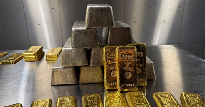 gold silver bars reuters scaled 1 1200x630.jpg