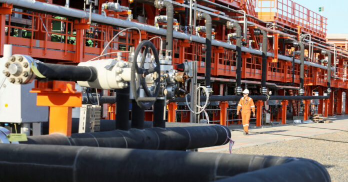 worker offshore oil reuters 1200x630.jpg